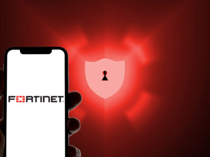 Fortinet logo on a smartphone in front of a defense shield as a symbolic image for antivirus software, anti spam, scam, malware Fortinet logo on a smartphone in front of a defense shield as a symbolic image for antivirus software, anti spam, scam, malware