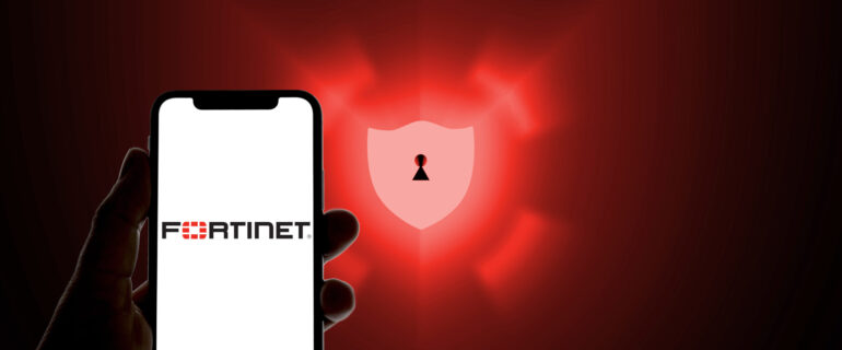 Fortinet logo on a smartphone in front of a defense shield as a symbolic image for antivirus software, anti spam, scam, malware Fortinet logo on a smartphone in front of a defense shield as a symbolic image for antivirus software, anti spam, scam, malware