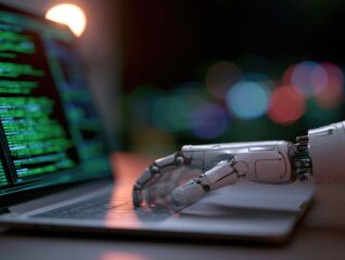 Robotic Hand Interacting with Laptop Displaying Code. A close-up shot of a robotic hand resting on a laptop keyboard, with lines of green code visible on the screen.